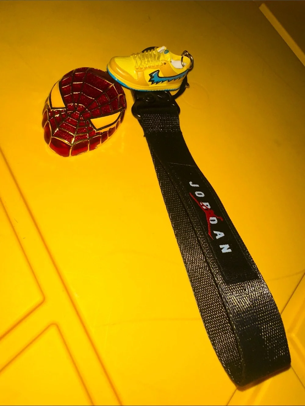 Jordan Kids Black Lanyard with Yellow jordSneaker Charm and Red Spider man Badge